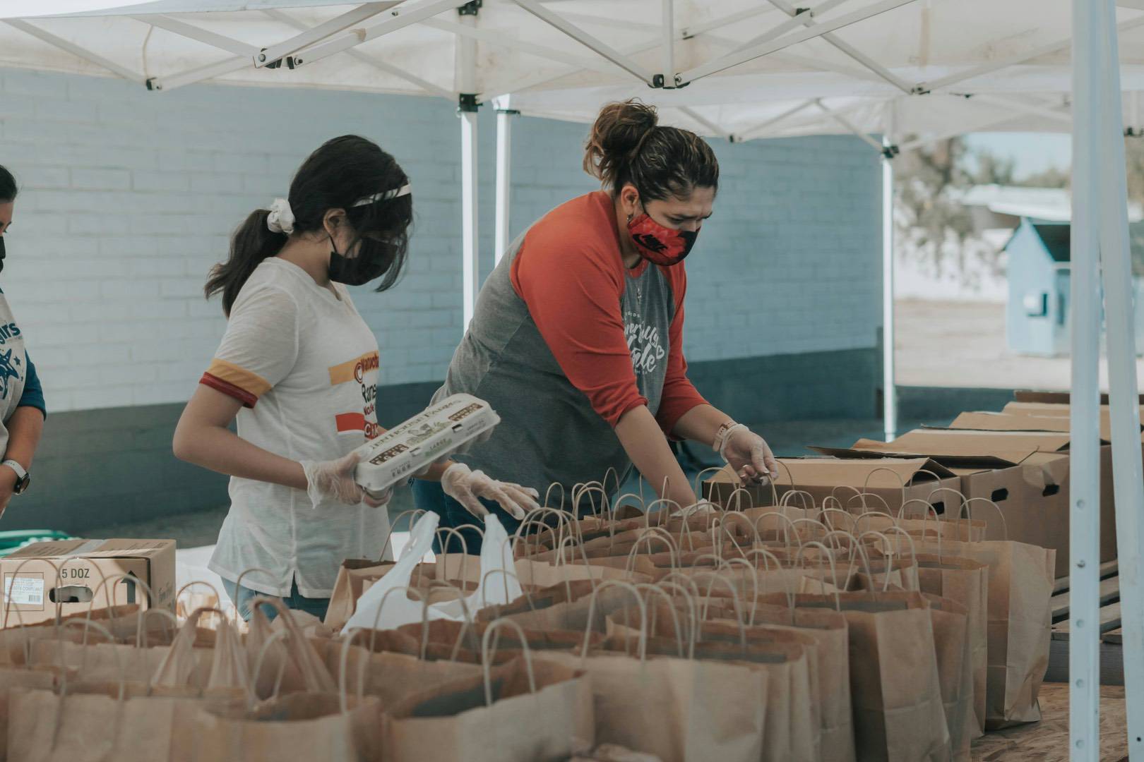 Food Bank staff prepaing donation bags